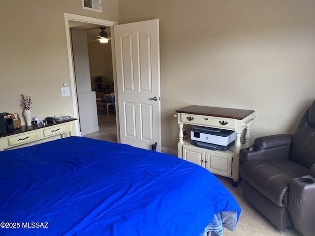 bedroom featuring light tile patterned floors and visible vents