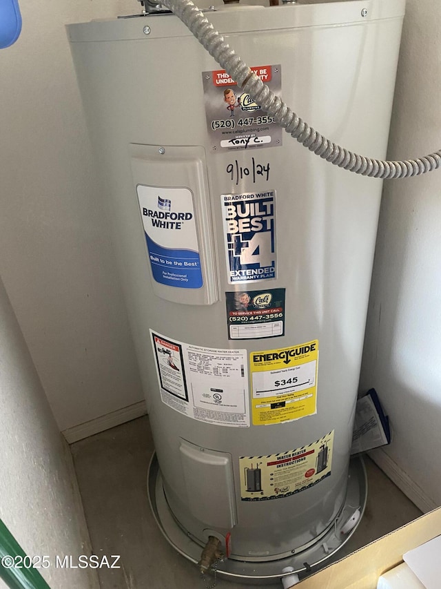 utility room featuring water heater