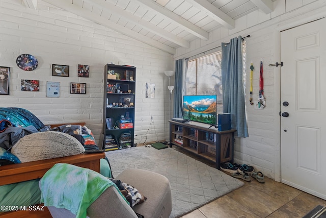 living room with vaulted ceiling with beams, wooden ceiling, and brick wall