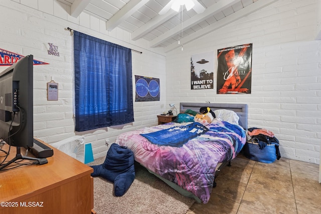 bedroom with ceiling fan, lofted ceiling with beams, and brick wall