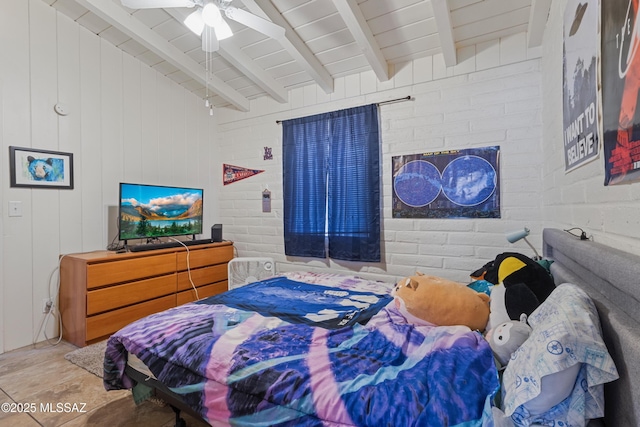 bedroom featuring brick wall, ceiling fan, and beam ceiling