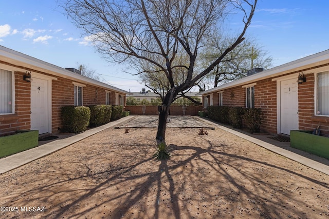 view of yard featuring fence and a patio