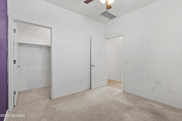 unfurnished bedroom featuring visible vents, baseboards, ceiling fan, carpet flooring, and a closet