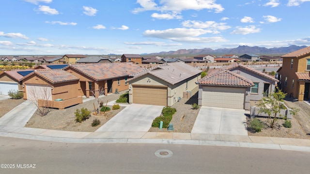 view of front of home featuring a residential view, stucco siding, a tiled roof, and a garage