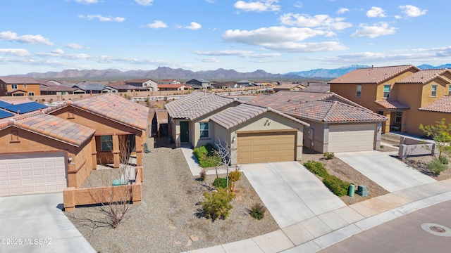 view of front facade featuring a residential view, stucco siding, a mountain view, and a tile roof