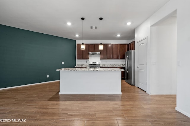 kitchen with light wood finished floors, dark brown cabinets, visible vents, and appliances with stainless steel finishes