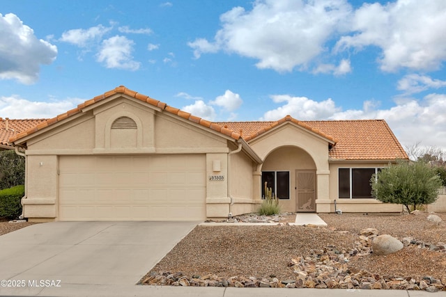 63606 E Desert Peak Dr, Tucson, AZ 85739 - view of front of home with a tile roof, an attached garage, driveway, and stucco siding
