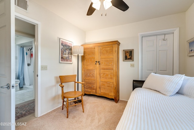 bedroom featuring light carpet, visible vents, baseboards, and ceiling fan