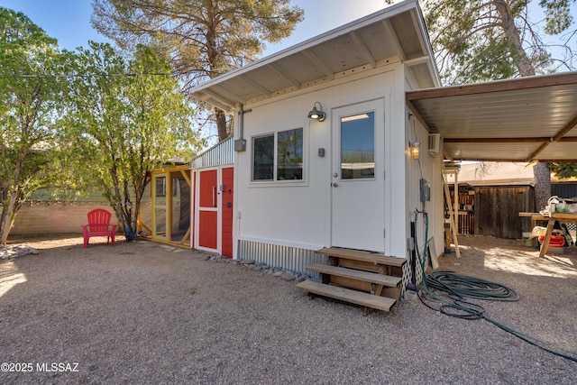 exterior space with entry steps and fence