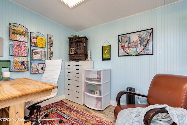 home office with crown molding, wood finished floors, and baseboards