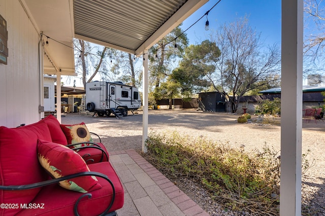 view of patio / terrace featuring a carport and fence