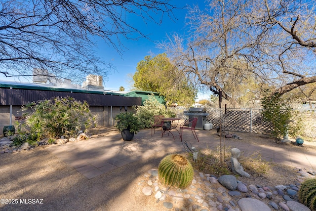 view of yard with a patio area and fence