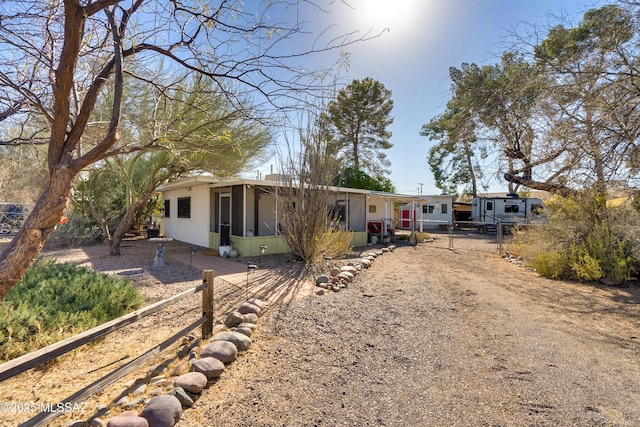 view of front of property with a sunroom