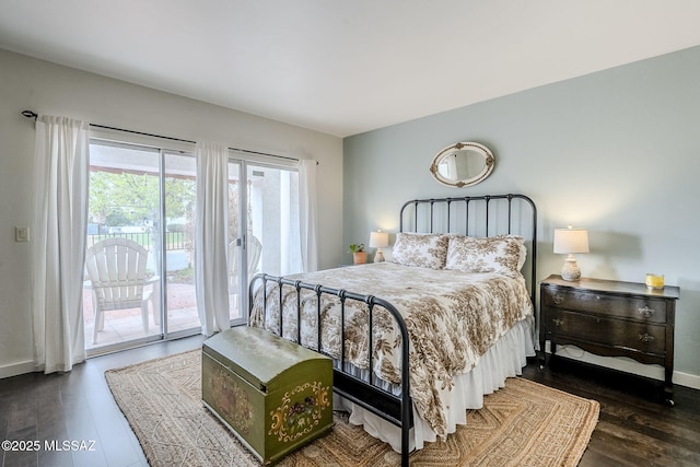 bedroom with access to outside, baseboards, and wood finished floors