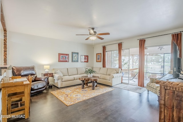 living room with ceiling fan and wood finished floors