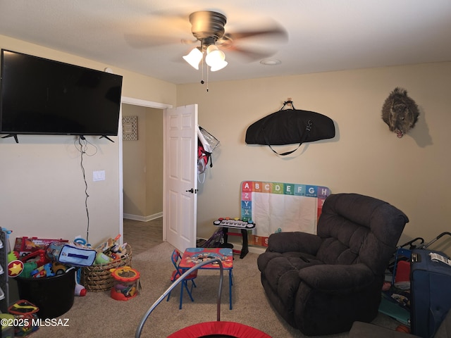 playroom featuring ceiling fan and carpet flooring