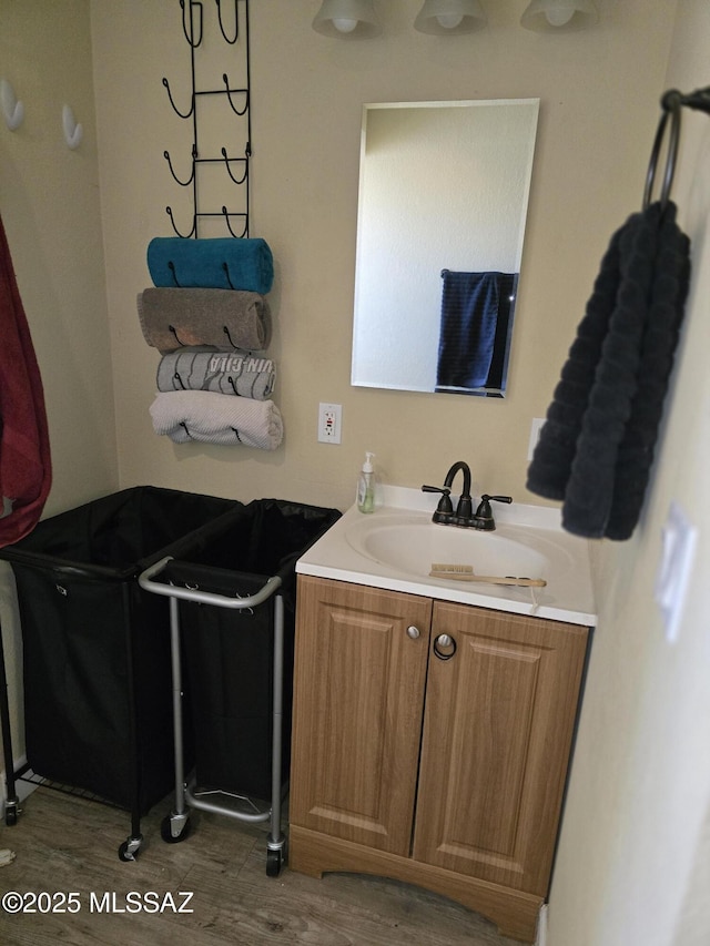 bathroom featuring wood finished floors and vanity