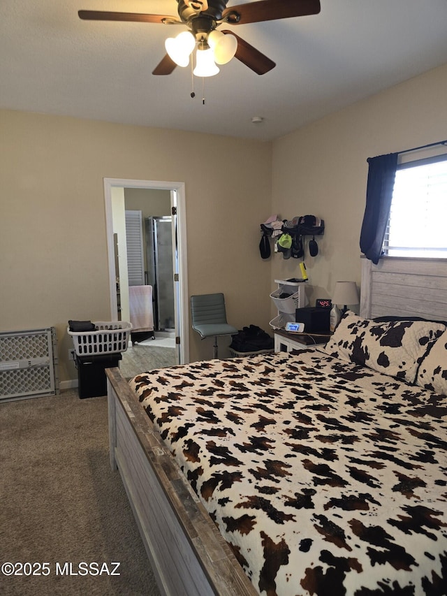 bedroom with a ceiling fan and carpet