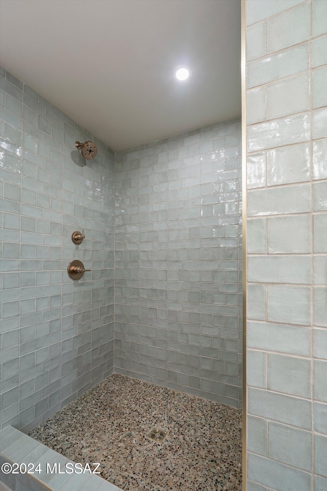 bathroom with visible vents, toilet, a walk in shower, and a sink