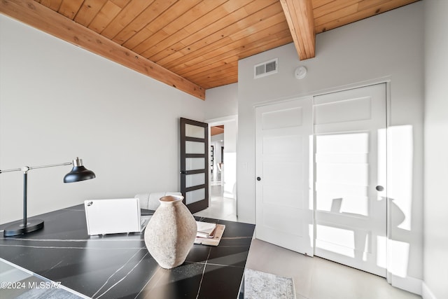 office area with wood ceiling, baseboards, and lofted ceiling with beams
