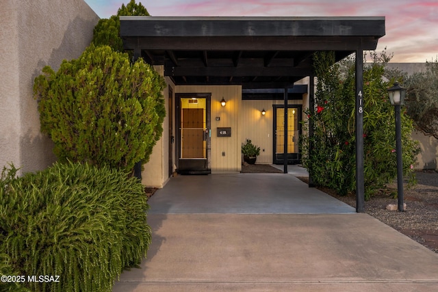 418 N Calle De Las Profetas, Green Valley, AZ 85614 - exterior entry at dusk with a carport and french doors