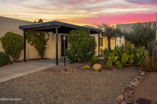 418 N Calle De Las Profetas, Green Valley, AZ 85614 - view of front of home featuring a carport, stucco siding, and concrete driveway