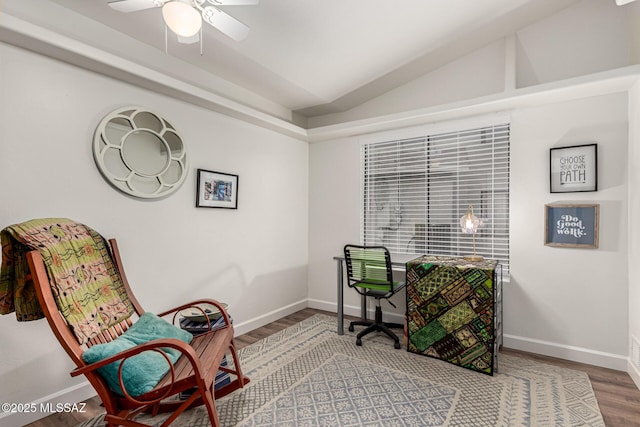 home office with a ceiling fan, lofted ceiling, baseboards, and wood finished floors