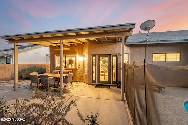 view of patio / terrace with outdoor dining area and fence