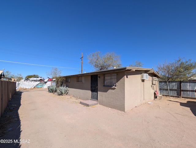 back of property featuring fence