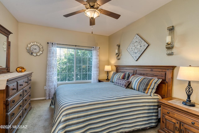 bedroom featuring light carpet, ceiling fan, and baseboards