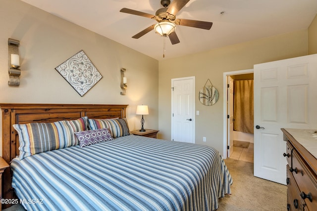 bedroom featuring light carpet and ceiling fan