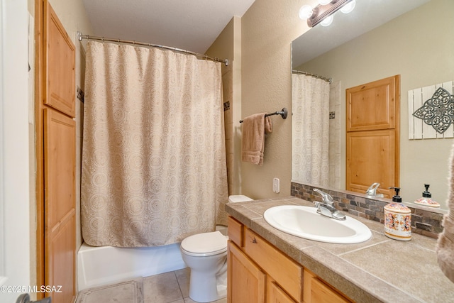 full bath with tile patterned flooring, vanity, toilet, and shower / bath combo