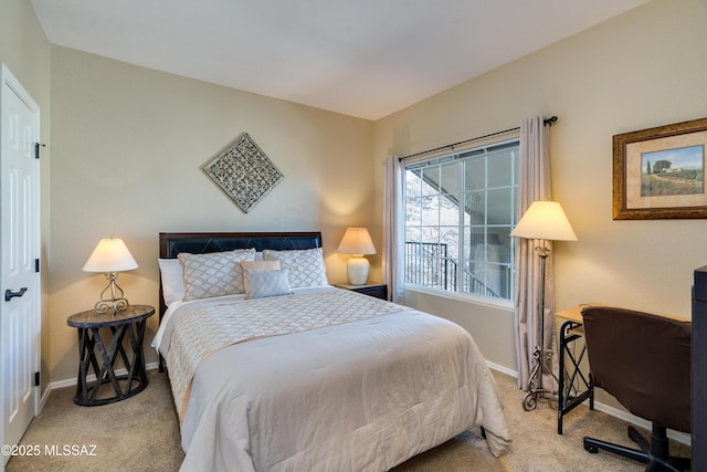 bedroom with carpet flooring and baseboards