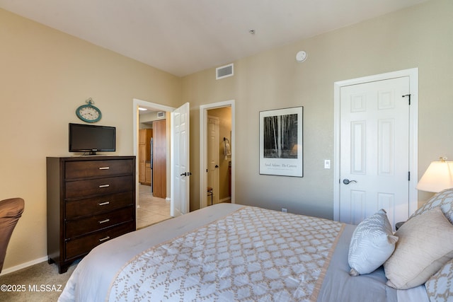 bedroom featuring light colored carpet, visible vents, and baseboards