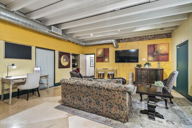 living room with beam ceiling