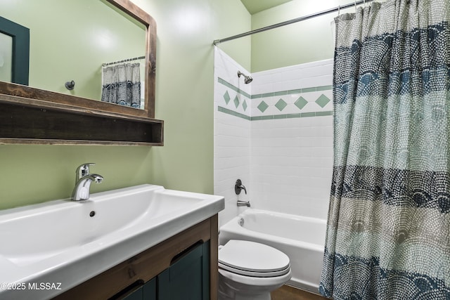 full bathroom featuring shower / bath combo, vanity, and toilet