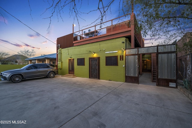 view of front of home with a gate