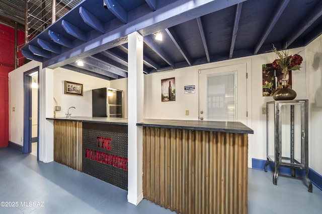 exterior space with outdoor dry bar and a sink