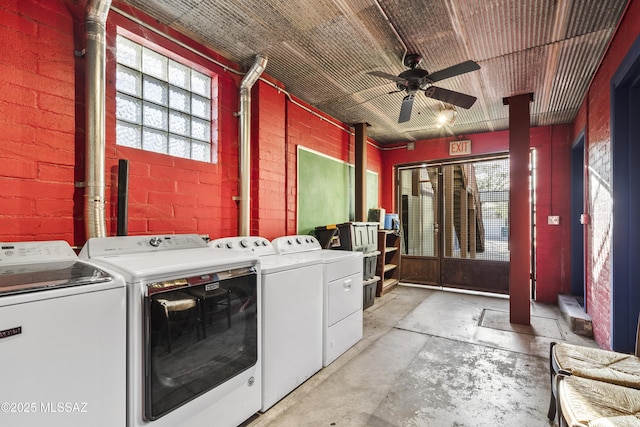 laundry area with laundry area, brick wall, ceiling fan, and washing machine and clothes dryer