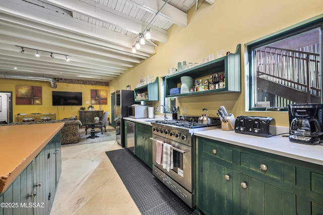 kitchen with green cabinets, light countertops, appliances with stainless steel finishes, and beam ceiling