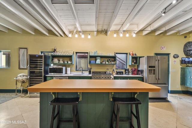 kitchen featuring light tile patterned floors, stainless steel appliances, open shelves, and light countertops