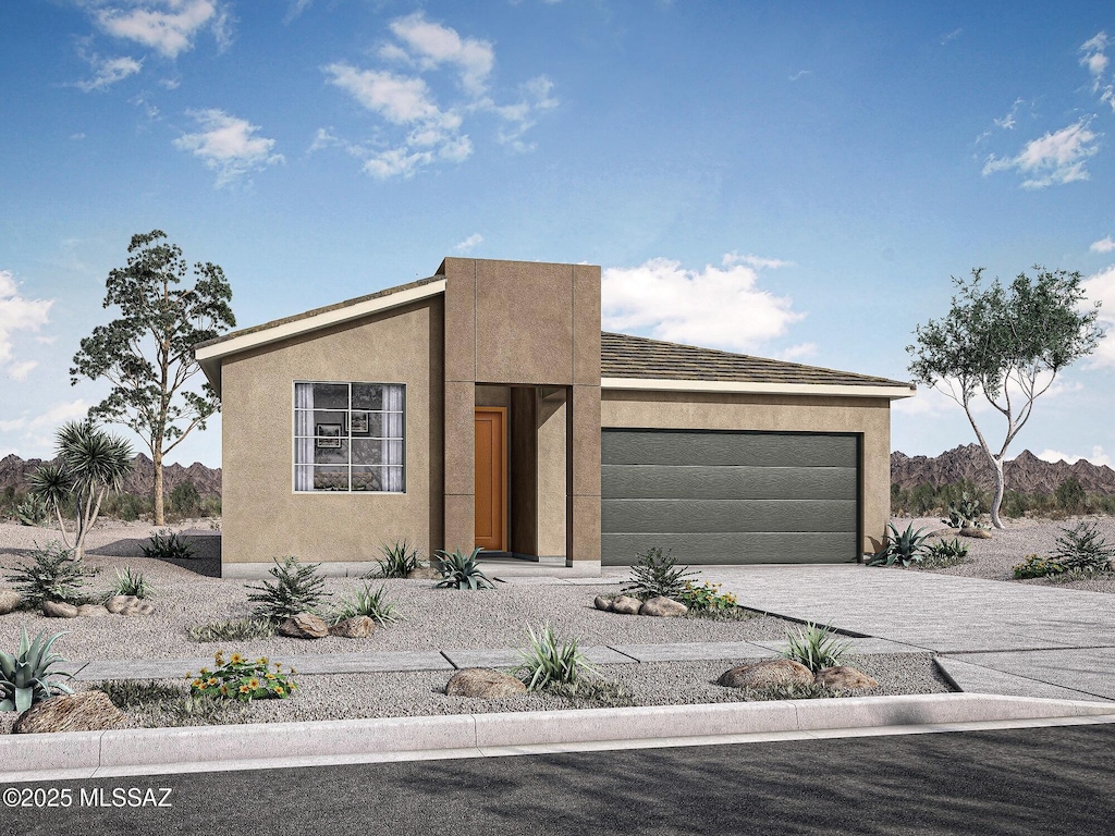 view of front of property featuring an attached garage, decorative driveway, and stucco siding