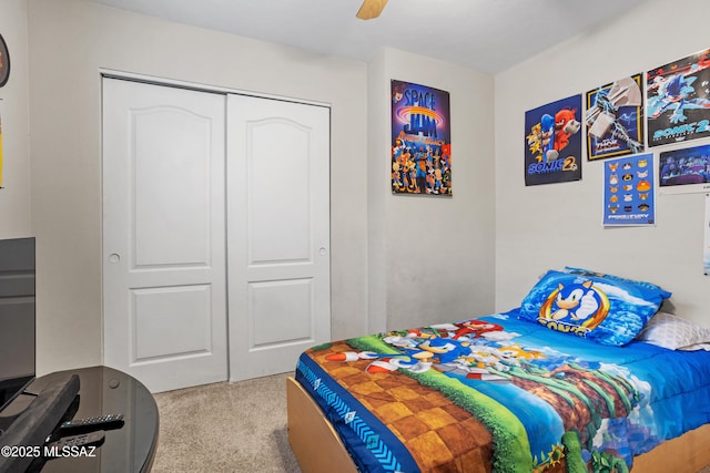 bedroom with carpet floors, a closet, and ceiling fan