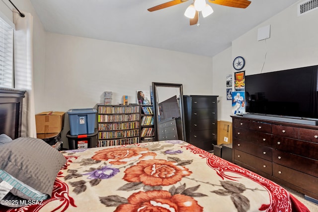 bedroom with ceiling fan and visible vents