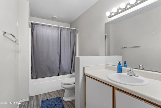 full bath featuring toilet, shower / tub combo, wood finished floors, and vanity