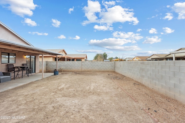 view of yard featuring a fenced backyard and a patio