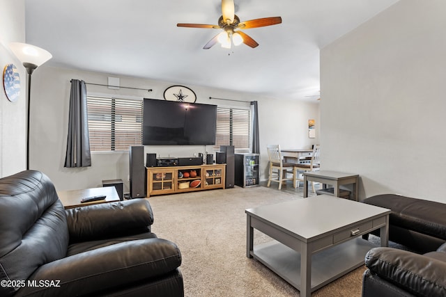 living room with carpet flooring and a ceiling fan
