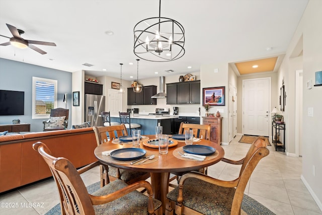 dining area featuring light tile patterned floors, baseboards, recessed lighting, and ceiling fan with notable chandelier
