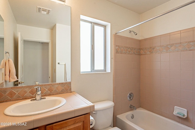 bathroom featuring tasteful backsplash, visible vents, toilet, vanity, and  shower combination