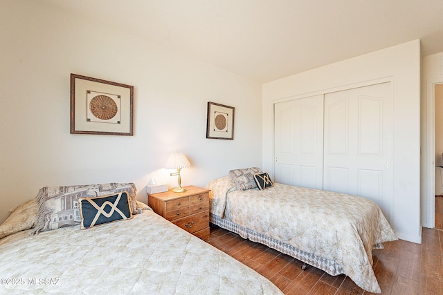 bedroom with a closet and wood finished floors